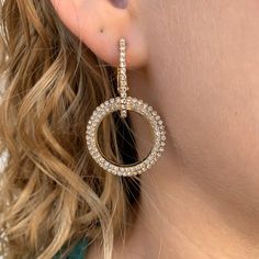 Brilliant cubic zirconia catches the light with every movement in this double loop statement earring. Elevate your jewelry collection with this versatile earrings that effortlessly transition from day to night. Double loop with Pave CZ Post Back Clip Elegant Round Hoop Earrings With Rhinestones, Elegant Cubic Zirconia Hoop Earrings With Bling, Elegant Round Sparkling Hoop Earrings, Diamond Single Earring For Party, Modern Gold Earrings With Sparkling Stones, Elegant Rhinestone Hoop Crystal Earrings, Glamorous Diamond Hoop Earrings, Glamorous Round Earrings With Sparkling Stones, Glamorous Round Diamond Crystal Earrings