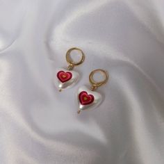 Don't miss out on these beautiful pink and red retro heart drop faux pearl earrings. They work with a large variety of looks and add a bit of sparkle to your outfit. MORE jewellery pieces available on our shop! Any questions please message we are happy to help. Free postage in UK Thank you for shopping with us Heather&Bumble 📪Follow us at: Instagram: heatherandbumble Twitter: Heather_Bumble Pintrest: Heather & Bumble Pink & Gold Retro Heart Drop Earrings - Red Heart Earrings,Pearl Earrings,Heart Jewellery,Pink Earrings In The UK,Pink Jewellery In The UK Heart-shaped Pearl Party Earrings, Valentine's Day Dangle Pearl Earrings For Pierced Ears, Heart-shaped Pearl Earrings For Valentine's Day, Cute Single Earring Jewelry For Valentine's Day, Cute Single Earring For Valentine's Day, White Pearl Earrings For Valentine's Day Party, Valentine's Day Pearl Drop Earrings For Anniversary, Single Earring For Valentine's Day, Valentine's Day Anniversary Pearl Drop Earrings