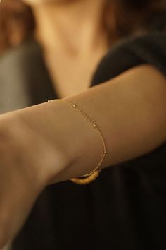 Introducing the Satellite Bracelet--a delicate and enchanting piece that gracefully adorns your wrist with understated elegance. Embrace the beauty of simplicity with this dainty chain bracelet that exudes charm and sophistication. 14k Gold Filled Bracelet Width - 1.2mm Extender - 1 inch If you would like a custom length, please don't hesitate to ask. We are more than happy to make one for you. All items come packaged in a gift box ready to give as a gift or keep for yourself. Gold-filled jewellery is a more affordable alternative to solid gold jewellery while still offering a similar appearance and durability. The thick layer of gold provides a long-lasting and tarnish-resistant finish so you can have pieces that will last. Our boxes are ECO friendly and FSC certified. FSC stands for Fore Dainty Beaded Bracelets With Satellite Chain, Adjustable Delicate Chain Charm Bracelet, Dainty Beaded Bracelet With Satellite Chain, Delicate Beaded Bracelet With Adjustable Chain For Gift, Delicate Adjustable Jubilee Chain Bracelet, Adjustable Beaded Bracelet With Delicate Chain For Gift, Delicate Bracelets With Tiny Beads, Dainty Charm Bracelet With Round Beads For Everyday, Dainty Charm Bracelet With Round Beads