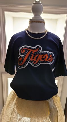 a mannequin wearing a t - shirt with the word tigers written on it