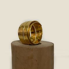 "This gold-filled multiband statement ring is an impressive and meaningful piece for everyday wear and special occasions.  It features an engraving of the Woman of Valor (Eshet Chayil) psalm of praise for the ideal woman. The husband sings this psalm to his wife on Sabbath Eve, Queen Sabbath, in tribute and love.  The psalm is an acrostic - every first letter in verse creates the entire Hebrew alphabet, from the letter 'Aleph' to 'Tav.' Rich with a romantic sentiment, this makes an excellent gif Spiritual Yellow Gold Engraved Ring In Brass, Spiritual Yellow Gold Engraved Brass Ring, Spiritual Engraved Yellow Gold Ring In Brass, Symbolic Gold Engraved Brass Ring, Symbolic Engraved Gold Ring In Brass, Gold Symbolic Engraved Brass Ring, Gold Symbolic Engraved Ring In Brass, Gold Adjustable Engraved Spiritual Ring, Adjustable Gold Engraved Spiritual Ring