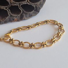 Embrace the charm with our exquisite O-Shaped Dot Bracelet. Crafted with precision, this retro-inspired bracelet features a delightful combination of 18k gold and stainless steel, resulting in a timeless piece of jewelry. The O-shaped dot design adds a touch of elegance and uniqueness, making it a perfect accessory for any occasion. The adjustable length of 6-8.5 inches ensures a comfortable and personalized fit for every wrist. Whether you're attending a party or simply looking to enhance your everyday style, this bracelet is a versatile choice. Its retro aesthetic adds a touch of nostalgia and sophistication to any outfit. As a thoughtful gift, this bracelet is sure to impress, capturing the essence of both style and sentiment. Elevate your jewelry collection with this vintage-inspired O Yellow Gold Metal Charm Bracelet, Handmade Gold-plated Bracelet, Dainty Gold Oval Bracelets, Handmade Gold Oval Bracelets, Gold Oval Bracelet As Gift, Handmade Oval Gold Bracelets, Gold Jubilee Bracelet Oval Shape, Gold Oval Jubilee Bracelet, Gold-plated Oval Bracelets