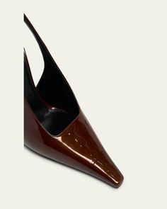 Saint Laurent "Stone" glossy leather pumps     4.33 in / 110 mm architectural heel    Elongated pointed toe    Adjustable slingback strap    Leather outsole    Made in Italy Slingback Pump, Leather Pumps, Bergdorf Goodman, Leather Straps, Saint Laurent, Tops Designs, In Italy, Pumps, Italy