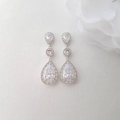 A Classic Earrings Drops for Wedding & Brides These Evana bridal earrings drops are made with glittering teardrop zirconia drops which are the main feature and will stand out and sparkle. In a classic design, these teardrop bridal earrings are great for brides and sparkle will make a statement look on your wedding day. These long drop earrings will look great with your other formal and special occasions wear too. These earrings are comfortable to wear not very heavy and a great size. The dro Diamond Long Drop Linear Earrings For Wedding, Diamond Linear Long Drop Earrings For Wedding, Dazzling Cubic Zirconia Linear Earrings For Wedding, Dazzling Long Drop Wedding Earrings, Dazzling Long Drop Earrings For Wedding, Long Drop Silver Crystal Earrings For Weddings, Diamond White Drop Linear Earrings For Wedding, Wedding Long Drop Linear Earrings In Cubic Zirconia, Sparkling Linear Drop Earrings For Wedding