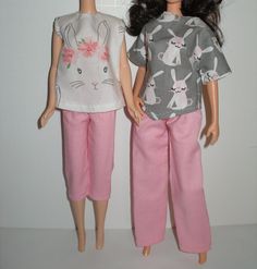 two dolls standing next to each other wearing pink pants and t - shirts with rabbits on them