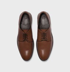 Brown Moc Toe Lace-up Shoes With Leather Footbed, Brown Wingtip Lace-up Shoes In Calf Leather, Leather Wingtip Lace-up Shoes For Business Casual, Modern Business Casual Lace-up Shoes With Leather Sole, Brown Brogue Lace-up Shoes For Office, Brown Brogue Lace-up Shoes With Moc Toe, Brown Goodyear Welted Lace-up Derby Shoes, Leather Lace-up Shoes With Textured Sole For Business Casual, Masculine Brown Leather Shoes With Almond Toe