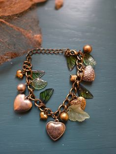 Adjustable from 5"-9", this is a vintage heart charm bracelet reimagined with fairy elements Trinkets Aesthetic, Fairy Elements, 80s Clothes, Solar System Bracelet, Funky Bracelet, Dr Wardrobe, Moss Ball, Vintage Charm Bracelet, Fame Dr