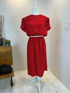 1980s Dress / 80s dress / 1980s polka dot dress / 1980s does 1950s / 1980s fashion / 80s fashion / 80s style / vintage dress This dress is from the 1980s and is the more comfortable version of the classic 1950s style. She has a colorful white polka dot print on a vibrant red. This dress would be perfect for a day dress or you can dress her up for and event. She is versatile! She has an elastic waist band to make her super comfortable and a full skirt. She slips over the head, gas built in shoulder pads, and has a button  at the back of the neck. Measurements provided are flat and have been doubled. modern size large Bust 44" Waist 30"-35"   Hips 48" Length 45" ❤️ Condition: Excellent vintage condition. Flaw : none. Belt not included. $148  includes domestic shipping and insurance. Internat Polka Dot Dresses For Vintage Fashion, Vintage Fashion Polka Dot Dresses, Retro Polka Dot Dress For Work, Retro Polka Dot Workwear Dresses, Spring Polka Dot Vintage Dress, 1950s Style Polka Dot Dresses For Spring, Vintage Polka Dot Knee-length Dress, Vintage Knee-length Polka Dot Dress, Summer Vintage Fashion Polka Dot Dress