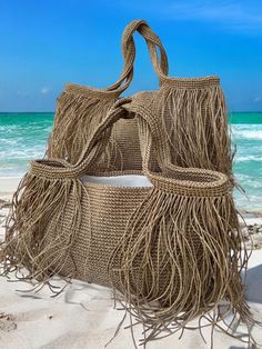 👜Crochet raffia tote bag is completely hand knitted natural paper rope raffia. 🏖️Our multipurpose bags are suitable for daily use such as beach and shopping.  Thanks to the pocket on the lining of the product, you will be able to organize your beach bag by placing your sun creams, wet and dry swimsuits, keys, wallet, glasses, etc.  You can also use it multipurpose for your other needs. It is a useful product that you can easily fit all kinds of things you may need on the beach.  👜The product Raffia Tote Bag, Summer Tote Bag, Crochet Beach Bags, Light Summer Dresses, Summer Tote Bags, Straw Beach Bag, Multipurpose Bag, Summer Tote, Fringe Bags