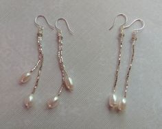 Sometimes less is more, so I have designed these simply elegant dangle earrings with strands of 15/0 seed beads for a simple silver chain of beads with these luscious fresh water pearls and accented with crystal rondelles.  The color is a pale champagne silver lined bead and a matching rondelles. A minimalist style earring for a special occasion or just because.   One pair is a single strand dangle and one pair is a double strand. Simply elegant! Elegant Bridal Jewelry, Minimalist Earrings Silver, Fresh Water Pearls, Silver Line, Water Pearls, Pearl Strands, Minimalist Earrings, Earrings Silver, Bridal Jewelry