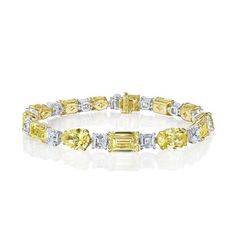 Experience the elegance of our mixed shape, fancy yellow and white diamond riviera bracelet, featuring asscher, emerald, heart, oval, pear, and radiant diamonds. Yellow Diamond Bracelet, Diamonds Direct, Fancy Yellow Diamond, Radiant Diamond, Radiant Cut, Yellow Diamond, Free Shopping, White Diamond, Fashion Bracelets