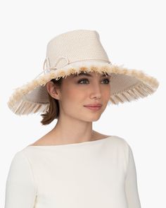 If you are looking for a woman's sun hat for sale online that is sure to turn heads, look no further! Named from the Caribbean Island that has endless beaches and warm turquoise water, this sun hat made of Squishee®, is a show stopper. This flirty, tropical sun hat combines the pinched crown of a fedora with a wide brim, edged all around with glamorous straw fringe. Wherever you adventure, from St. Barths to Antibes, approving smiles are sure to follow! Squishee® straw is a sustainable man-made Upf 50+ Short Brim Hat For Pool, Short Brim Hat With Upf 50+ For Pool, Lightweight Sun Hat For Kentucky Derby, Upf 50+ Short Brim Panama Hat For Pool, Upf 50+ Brimmed Panama Hat For Pool, Uv Protection Flat Brim Sun Hat For Kentucky Derby, Upf 50+ Hats For Pool, Sun Hats With Upf 50+ For Vacation, Upf 50+ Coastal Hat For Sunbathing