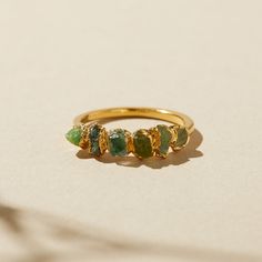 Features hiddenite, prasiolite (green quartz/amethyst), peridot, green tourmaline, emerald, and green garnet in a distinctive ombre arrangement. Green Ombré Birthstone Ring with hiddenite, prasiolite, peridot, and green amethyst, this ring is the perfect way to show off your favorite green stones. Green Tourmaline Jewelry, Ombre Ring, Raw Stone Rings, Raw Emerald Ring, Textured Ring Band, Ombre Rings, Raw Peridot, Pink Garnet, May Birthstone Rings