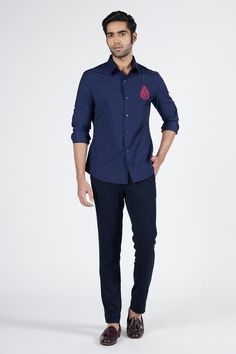 Navy slim fit shirt accentuated with thread work.
Components: 1
Pattern: Embroidered
Type Of Work: Thread
Neckline: Collar
Sleeve Type: Full
Fabric: Terylene, Viscose, Lycra
Color: Blue
Other Details: 
Closure: Front buttons
Note: Pant worn by the model is not for sale
Occasion: Party - Aza Fashions Fitted Embroidered Shirt For Work, Formal Embroidered Button-up Shirt, Formal Embroidered Cotton Shirt, Fitted Embroidered Shirt With Spread Collar, Embroidered Fitted Shirt For Formal Occasions, Formal Fitted Embroidered Shirt, Designer Embroidered Shirt For Work, Designer Embroidered Workwear Shirt, Men Shirts