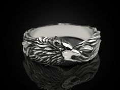 This beautiful silver Wolf ring is the perfect gift for that person in your life whose spirit animal is the powerful Wolf. Cast in beautiful 925 silver, this ring is sure to catch the attention of people. Each rings is handmade in the USA by a veteran and is made to your specifications. Each ring is shipped in a stained, wooden display box. Please verify ring size prior to ordering. Returns/refunds due to improper size ordered will not be accepted. Returns/exchanges due to other conditions will be accepted for 7 days after ring is received and only after the unsatisfactory ring has been returned to the seller. If you have any questions, shoot me a message! Wolf Ring, Animal Ring, Wolf Jewelry, Minimal Ring, Silver Wolf, Head Ring, Gothic Rings, Silver Signet Ring, Animal Rings