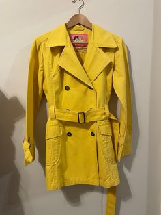 1980s Fiorucci trench coat in yellow. Size Medium. Yellow Long Sleeve Raincoat For Spring, Long Sleeve Yellow Raincoat For Spring, Retro Yellow Outerwear For Spring, Retro Yellow Spring Outerwear, Vintage Yellow Cotton Outerwear, Yellow Trench Coat, Womens Jackets, Trench Coat, Portugal