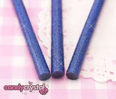 10 x Blue glitter hot melt glue sticks for mini glue guns - £2.35  http://candy-crystal.co.uk/diy-deco-supplies/deco-sauces-glues/10-x-dark-blue-glitter-deco-sauce-decoden-hot-melt-glue-sticks-10cm.html  SKU: 1183 Glue Sticks, Blue Glitter, Hair Straightener, Glue, Dark Blue, Sauce, Candy, Glitter