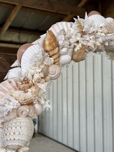 a wreath made out of seashells and shells