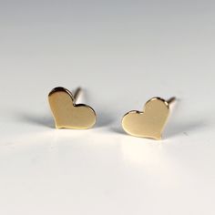 "Modern, simple, gold filled heart stud earrings. Everyday earrings. Gold filled hearts are 5mm x 7mm. ------------------------- MATERIAL GOLD FILLED ! 100% quality 14k gold filled. More durable and longer lasting than any gold plated items. Gold-filled is composed of a solid layer of gold (typically constituting at least 5% of the item's total weight) mechanically bonded to a base metal. Gold-filled is a USA industry standard that legally requires 1/20th, or 5% pure gold by weight. 100x thicker Gold Minimalist Heart Earrings For Everyday, Minimalist 14k Gold Heart Earrings, Minimalist Everyday Open Heart Earrings, Minimalist Gold Hypoallergenic Heart Earrings, 14k Gold Filled Heart Earrings For Pierced Ears, Minimalist Open Heart Earrings For Everyday, Dainty 14k Gold Filled Heart Earrings For Everyday, Minimalist Heart Charm Earrings For Valentine's Day, Everyday Heart-shaped 14k Gold Filled Earrings