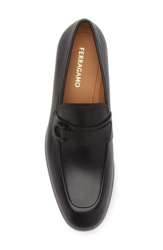 A layered strap secured with tonal Gancio hardware tops this calfskin leather loafer that's a suave and contemporary classic. Leather upper, lining and sole Made in Italy Designer Shoes Elegant Slip-on Monk Strap Shoes In Calf Leather, Elegant Slip-on Calf Leather Loafers, Elegant Monk Strap Moc Toe Shoes For Work, Elegant Slip-on Leather Loafers, Elegant Calf Leather Monk Strap Shoes, Elegant Calf Leather Monk Strap Shoes For Business Casual, Luxury Monk Strap Shoes With Moc Toe For Office, Luxury Monk Strap Shoes With Removable Insole For Office, Elegant Slip-on Monk Strap Shoes For Business