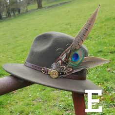 Beautiful hand crafted feather hat pins Pheasant feather and a used 12 bore shotgun cartridge (brand may vary) with brooch pin back Add sparkle with my Genuine SWAROVSKI Crystals select from drop down menu. Please leave a note at checkout with colour required. colour options red, tangerine, green, purple, pink, aqua, clear, sapphire blue and clear Ab. If no note is left clear will be sent Great accessory for any outfit Great present comes boxed. (Fedora/hat not inc) Hand made to order. May vary Red Fedora, Race Outfit, Colbalt Blue, Pheasant Feather, Wool Fedora Hat, Large Feathers, Country Wear, Purple Paint