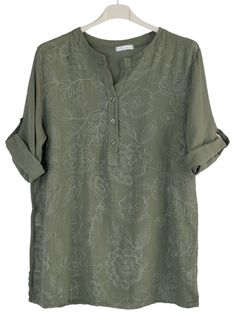 Discover effortless summer style with our Embroidered Henley Cotton Tunic Top. Made from lightweight fabric, this delicate embroidered top is perfect for warm days. The Henley neckline adds a touch of elegance, making it suitable for both casual and dressy occasions. Upgrade your wardrobe with this versatile top. Embroidered Henley Cotton Tunic Top  Henley Neckline Beautiful Intricate Embroidered Front 3/4 Roll Tab Sleeves Breathable Cotton One Size Soft and Lightweight Perfect for Summer 100% C Summer V-neck Blouse With Floral Embroidery, Summer V-neck Blouse With Chikankari Embroidery, Relaxed Fit V-neck Top With Floral Embroidery, Relaxed Fit V-neck Embroidered Top With Floral Embroidery, Vacation Linen Blouse With Floral Print, Casual Embroidered Linen Blouse, Floral Print Linen V-neck Top, V-neck Linen Tops With Floral Print, Green Blouse With Floral Embroidery And Relaxed Fit