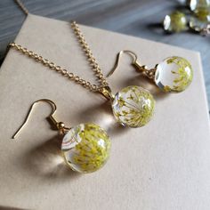 Beautifully Elegant Yellow Flower Earrings And Necklace Set, Elegant Glass Orb Earrings With Delicate, Dried Flowers Inside. Solid Glass Ball Earrings Have Warm Gold Finishing And Hooks. Necklace Chain Is 18 Inches In Length, And Is 18k Gold Plated Stainless Steel. Yellow Jewelry For Summer Gifts, Gold Birth Flower Jewelry For Summer, Yellow Summer Jewelry Gift, Spring Yellow Round Jewelry, Yellow Flower Shaped Earrings For Gift, Yellow Flower Earrings For Gift, Yellow Flower Earrings As Gift, Yellow Flower-shaped Earrings For Gifting, Spring Jewelry With Pressed Flowers For Gifts