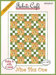 a green and white checkered quilt with an orange flower design on the front cover