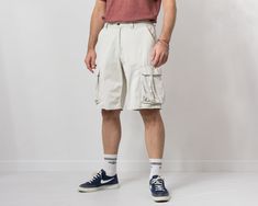 "Vintage cargo style denim shorts in cream - 6 pockets - zip fly - materials: 100% cotton SIZE size from label: W34 best fits men: L MEASUREMENTS waist: 33.5 inches (85 cm) hips: 46.5 inches (118 cm) rise: 12 inches (30.5 cm) length: 23 inches (58 cm) inseam: 11.5 inches (29 cm) The model is 6'1\" (186 cm), measures 41-35-39 (104-88-100 cm). CONDITION: The shorts in good pre-owned condition. Washed, ready, to wear." Beige Utility Cargo Shorts, Beige Cotton Cargo Shorts With Multiple Pockets, Casual Beige Cargo Shorts With Multiple Pockets, Beige Cargo Shorts With Multiple Pockets, Beige Cargo Shorts For Spring, Spring Beige Cargo Shorts With Pockets, Casual Beige Cotton Cargo Shorts, White Cargo Shorts With Side Pockets For Spring, Beige Cotton Cargo Style Shorts