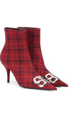 Baleciaga's red and black plaid canvas ankle boots are adorned at the vamp with a silvertone BB logo.Styled with a pointed toe, this pair is finished with a self-covered stiletto heel.3.25"/85mm heel (approximately).4.75"/120mm shaft, 10.00"/25cm circumference (approximately).Pointed toe.Self-covered stiletto heel.Polished silvertone and black hardware.Concealed side zip closure.Lined with leather.Leather sole.Red/Black.Made in Italy. Leather Thigh High Boots, Balenciaga Logo, Black Leather Wedges, Un Logo, Luxury Women Fashion, Black Suede Boots, Red And Black Plaid, Leather Wedges, Black Nylon