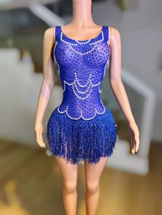 Material: High-quality sheer fabric adorned with sparkling sequins and pearl embellishments Design: Eye-catching royal blue dress with intricate sequin and pearl patterns Neckline: Elegant scoop neckline with delicate pearl detailing Straps: Spaghetti straps for a sleek and secure fit Fit: Bodycon silhouette that hugs your curves and enhances your figure Length: Mini dress length with a playful fringe hemline that adds movement and flair Back: Simple and smooth back design to balance the ornate Elegant Blue Dress With Pearl Details, Blue Embellished Sequin Dress For Summer, Elegant Blue Dress With Pearl Embroidery, Blue Embellished Sequin Summer Dress, Royal Blue Sleeveless Sequin Dress, Royal Blue Sleeveless Dress With Sequins, Glamorous Blue Rhinestone Dress, Royal Blue Sequined Party Dress, Royal Blue Embellished Sleeveless Dress