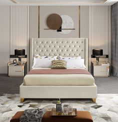 a bedroom with a large bed and white furniture