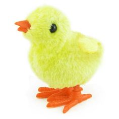 a small yellow toy duck sitting on top of a white surface