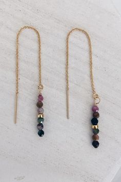 COLOR: Gold The semi-precious gemstone threaders are gold filled adorned with hand beaded gemstones and gold beads. These gemstones have a pretty sparkle that add a touch of simple glam dressed up or down! DETAILS + CARE: 14k gold filled Length: 3.5 inches ﻿ AVAILABLE GEMSTONE COLORS: Apatite Black Spinel Labradorite Mystic Silverite Moonstone Pink Moonstone Tourmaline Solid Gold Metal And Beads Jewelry, Diy Fine Jewelry, Adjustable 14k Gold Filled Threader Earrings For Gifts, Adjustable 14k Gold Filled Threader Earrings As Gift, Gold Spiritual Earrings With Gemstone Beads, 14k Gold Filled Jewelry With Gemstone Beads, Adjustable Gold Earrings With Beaded Chain, Adjustable Long Drop 14k Gold Filled Threader Earrings, Adjustable 14k Gold Filled Long Drop Threader Earrings