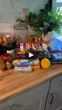 a kitchen counter topped with lots of food