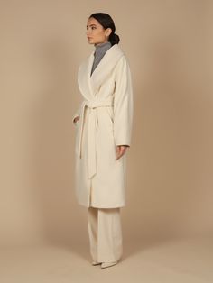 The one, the only, the ultimate staple in the wardrobe of any lady. This timeless piece is crafted using the finest double 100% virgin Italian and cashmere blend fabric (90% virgin wool, 10% cashmere), with an incredibly chic oversized fit. Hand picked stitching along the collar, sleeves, belt, pockets and back give this piece the opulent finish that a piece of this exquisite standard deserves. Tie the matching belt for an unremarkably feminine hourglass silhouette, or simply close the buttons a Pick Stitch, Trench Coat Dress, Silk Coat, Faux Fur Hat, Hourglass Silhouette, Cashmere Fabric, Outfit Formulas, Shades Of Beige, Cashmere Coat