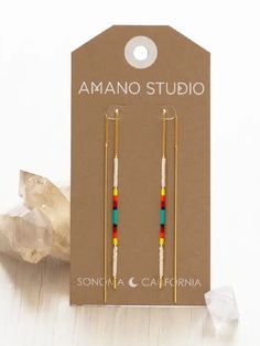 These swishy, sexy and stunning ear thread earrings by Amano combine their best-selling threaders with their best-selling Miyuki seed bead earrings. Great for summer, and elegant enough for a dressy night out. Simply thread in and go! Made with genuine Japanese Miyuki beads in a variety of color combinations and 14k gold plated brass. Choose from the following colorways: Champagne: A neutral mix of rose gold, gold and copper beads Chocolate: A rich blend of neutral brown, gold and black earth to Minimalist Seed Bead Earrings, Polymer Clay And Seed Bead Earrings, Ear Thread Earrings, Seed Bead Earrings Ideas, Seed Bead Color Combinations, Seed Bead Earring Patterns, Seed Bead Earrings Diy, Diy Thread Earrings, Beaded Christmas Earrings