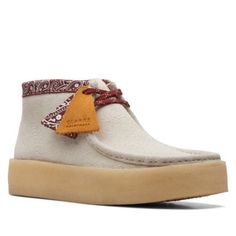 Clarks Brings The Perfectly Crafted Wallabee Cup White Boots To Your Closet For The Cooler Seasons. This Eye-Catching Shoe Is Designed With A Multicolored Hairy Suede Upper, A Flexible Moccasin Construction, A Natural Renewable Crepe Sole, And Lace Closures For The Perfect Fit. Lace Closures Suede Upper Flexible Moccasin Construction Natural Renewable Rubber Crepe Sole Completed With Two Clars Original Fobs Clarks Mens Wallabee Cup Wallabee Clarks, Clarks Shoes Mens, Clarks Originals Men, Mens Leather Chukka Boots, Clarks Wallabee, Clarks Wallabees, Suede Chukka Boots, Suede Chukkas, Men's Clarks