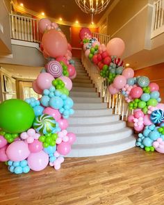 the staircase is decorated with balloons and streamers