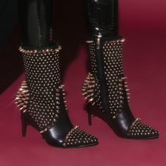 The Azalea Wang Dancin With The Spiked Devil Stiletto Bootie In Black Is An Ultra-Luxe Mid Calf High Boot Featuring A Faux Leather And Suede Upper, Pointed Toe Silhouette, Glossy Stiletto Heel, And Tonal Inner Zipper Closure. Complete With Intricate Studded Detailing Throughout. - All Man-Made Materials - 7” Shaft - 4.5” Heel - Imported Black Punk Heels For Party, Winter Punk Party Heels, Punk Style Winter Party Heels, Punk Winter Party Heels, Punk Style Heels For Winter Parties, Glamorous Fall Party Heels, Edgy Winter Party Heels, Black Punk Heels For Evening, Glamorous Heels For Fall Night Out