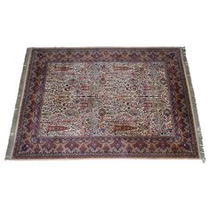 an antique persian rug is displayed on a white background