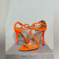 Worn Lightly Neon Orange Jimmy Choo Sandals, In Size 37.5, True To Size, Original Retail $895; Elegant Orange Open Toe Sandals, Luxury Orange Sandals For Formal Occasions, Formal Orange Sandals With Heel Loop, Luxury Orange Evening Sandals, Luxury Orange Heels For Spring, Elegant Orange Evening Sandals, Designer Orange Sandals For Party, Elegant Orange Heels With Heel Loop, Luxury Orange Sandals With Removable Insole