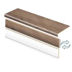 the side profile of a wood and white skirting board with an arrow pointing up at it