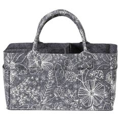 a black and white bag with flowers on the front, two handles and an inner pocket