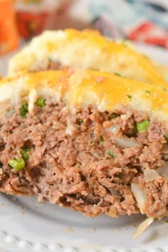 a meatloaf on a plate with mashed potatoes