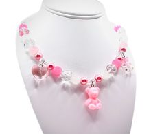 These are handmade, hand crafted beaded necklace with diamond beads and pink and white pearls, with three cute little charms attached with the necklace . These necklaces are for all ages, weather your a child who loves to play and be fashionable and have fun or a adult who loves cute and fun things! This fashion accessory will bring joy to you, especially for gifts !  These jewelry is locally made in Austin TX if you have any questions please feel free to contact us at our message board .  Fragi Cheap Playful Pink Charm Necklaces, Affordable Playful Pink Charm Necklaces, Cheap Pink Charm Necklaces With Heart Beads, Cheap Pink Beaded Charm Necklaces, Cheap Personalized Pink Beaded Necklaces, Cheap Pink Charm Necklaces, Cheap Pink Beaded Necklaces With Heart Beads, Cheap Fun Pink Charm Necklace, Pink Birthday Charm Necklace