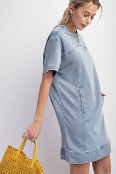 Details Brand: Easel Denim Tunic Dress Mineral Wash Panel Detailing Rounded Neckline Slightly Dropped Shoulders Short Sleeves Front Pockets Snap Back Button Closure Material and Care 97% Cotton 3% Spandex Hand Wash Cold Hang or Line Dry Measurements of Garment Bust of the garment is measured armpit to armpit and then doubled. Length of the garment is measured from the top of the shoulder to the bottom of the hem line. Sleeve Length of the garment is measured from the top part of the shoulder sea Short Sleeve Denim Mini Dress With Pockets, Denim Mini Dress With Pockets And Short Sleeves, Casual Short Sleeve Denim Blue Mini Dress, Knee-length Washed Denim Blue Dress, Casual Short Sleeve Denim Mini Dress, Casual Washed Blue Denim Dress With Pockets, Trendy Light Wash Short Sleeve Denim Dress, Casual Medium Wash Denim Dress With Pockets, Light Wash Denim Mini Dress With Pockets