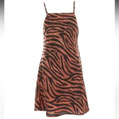 From Gb, This Dress Features: Animal Print Square Neckline Sleeveless Mini Length A-Line Silhouette Polyester Blend Machine Wash/Tumble Dry Trendy Brown Beach Dress, Sleeveless Brown Tiger Print Dress, Brown Sleeveless Tiger Print Dress, Casual Sleeveless Tiger Print Dress, Casual Brown Tiger Print Dress, Casual Black Tiger Print Dress, Casual Black Dress With Tiger Print, Animal Print Mini Dress, M Girl