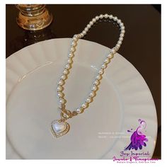 Product information: Color: X905 gold Pendant material: mixed gem inlaid Chain style: Pearl Chain Material: Pearl Shape: heart shape Circumference: 21cm (inclusive)-50cm (inclusive) Packing list: Necklace*1 Product Image: Trendy Pearl Chain Necklace For Valentine's Day, Valentine's Day Gold Rhinestone Necklace, Gold Alloy Heart Necklace, Pearl Clavicle Chain Jewelry With Heart Shape, Gold Heart-shaped Alloy Necklace, Pearl Heart Clavicle Chain Jewelry, Heart-shaped Pearl Clavicle Chain Jewelry, Trendy Gold Plated Heart Necklace With Clavicle Chain, Trendy Heart-shaped Pearl Chain Necklace