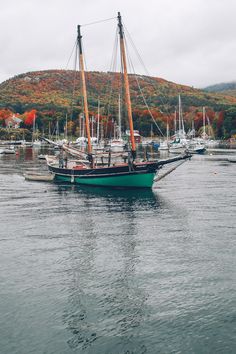 a sailboat floating on top of a body of water